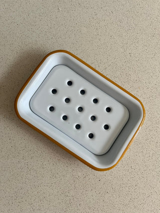 White enamel soap dish with mustard yellow rim