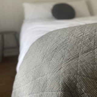 Grey striped cotton quilt of