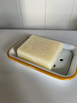 White enamel soap dish with mustard yellow rim