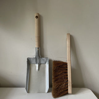 Metal and wood dustpan and brush